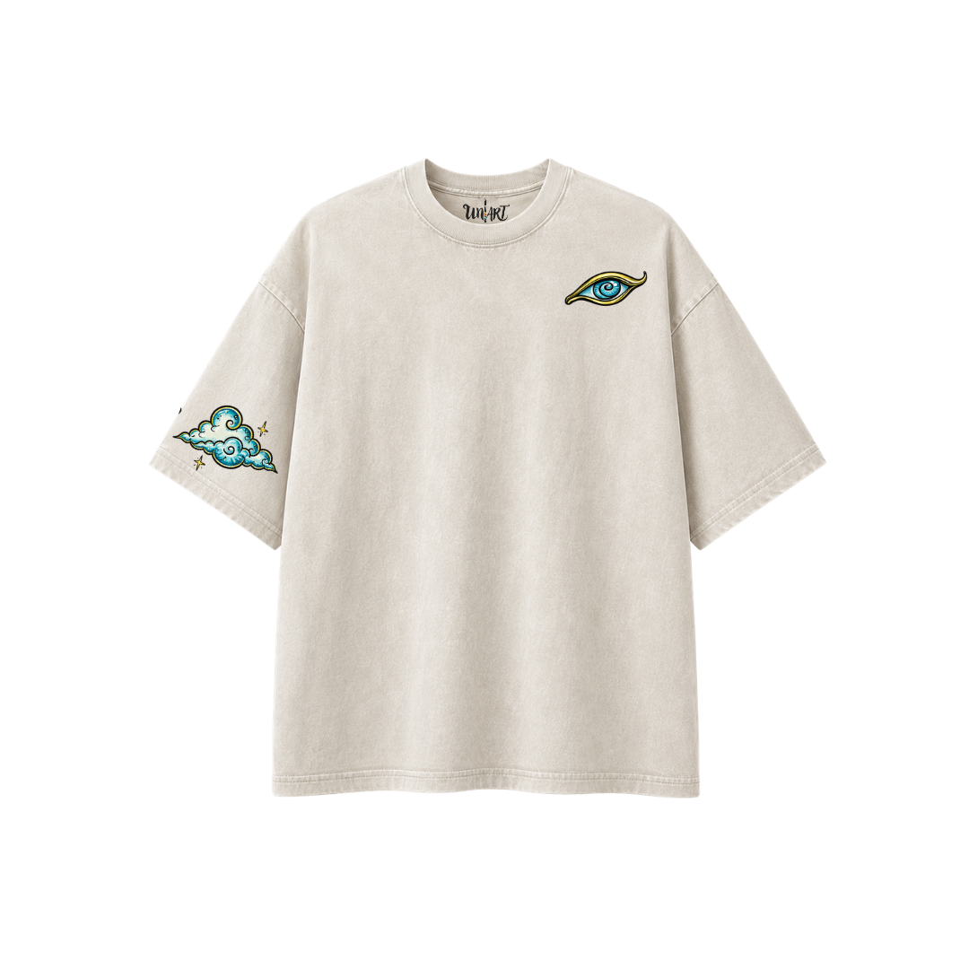 Front view of the Time Spiral oversized graphic t-shirt in off-white, featuring an original hand-drawn eye artwork on the chest and a cloud illustration on the sleeve. Made from 100% premium cotton and designed by Uniart.