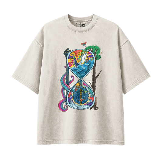 A light beige/cream short-sleeve t-shirt with a large, colorful graphic print on the front. The graphic features a stylized infinity symbol split into a top half showing a blue winged figure in a sun and a bottom half showing a tree and a blue globe, with a pink snake and green tree trunk.